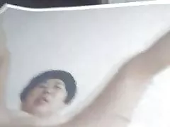 A woman and a young guy fucking in bed