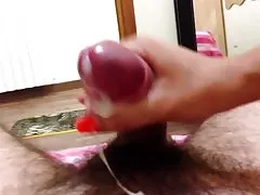 Tanned trans bitch fingering hairy pussy with a vibrator and cums